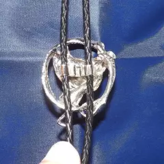 Western Saddle and Lariat on Braided Leather Bolo Tie. Silver Color Metal