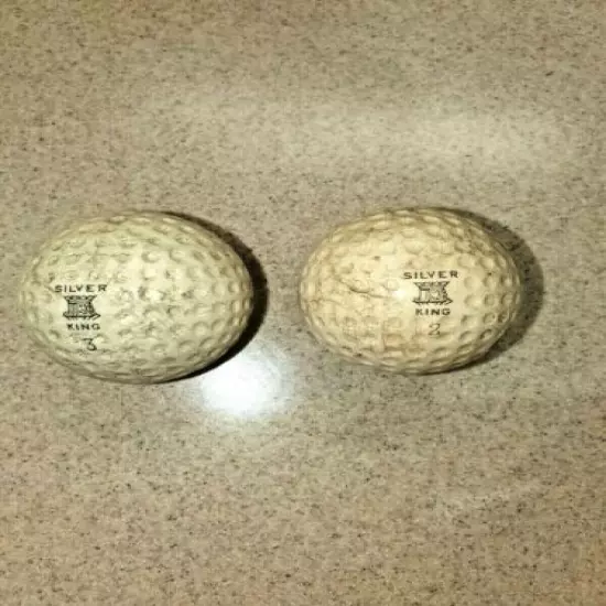 TWO VINTAGE SILVER KING GOLF BALLS WITH GEER PATENT & CALDWELL COVERS