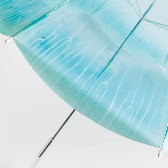 YOU+MORE! A moon jellyfish umbrella swimming in the rainy sky