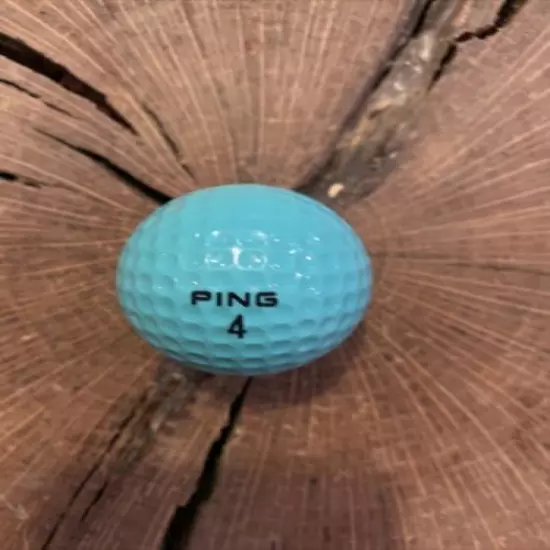 VINTAGE AQUA AND WHITE PING EYE GOLF BALL