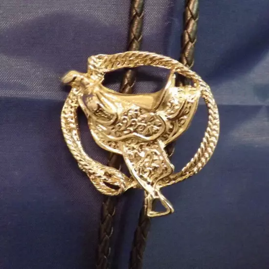 Western Saddle and Lariat on Braided Leather Bolo Tie. Silver Color Metal