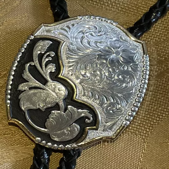 Montana Silversmith Western Bolo Tie Engraved Silver Oval w/ Leather Rope