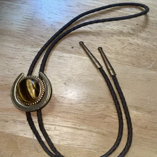 Vtg Nat. Tigers Eye Set In Horseshoe Bolo Tie Gold Tone Setting and Tips 1970's