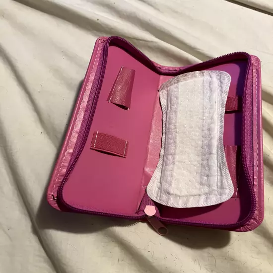 pink zip wallet perfect for tampons , pad or lipstick