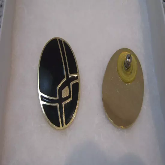 Very Pretty Black Pierced Earrings with a Gold Design Running Through Them