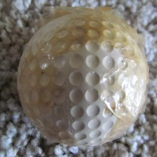 VINTAGE SPALDING TOP-FLITE DOUBLE DOT GOLF BALL WITH PARTIAL CELLOPHANE WRAPPER