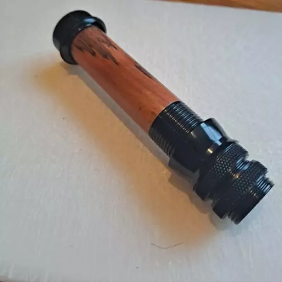 Fly rod reel seat in black with a wood spacer