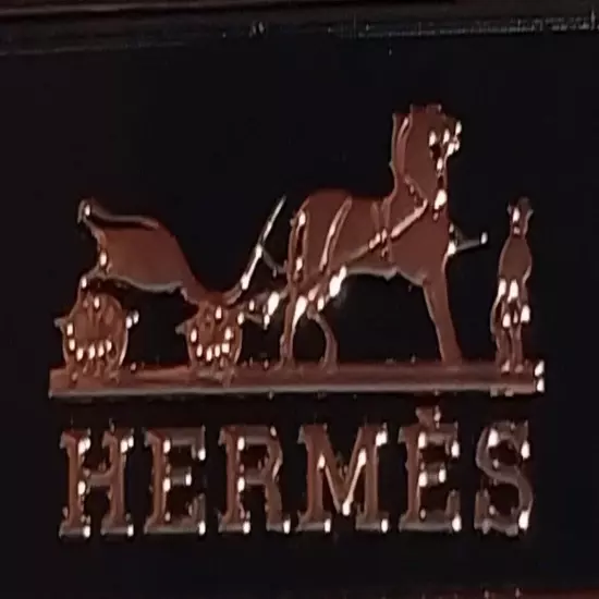 HERMES. Belt buckle with "HERMES" inscription. Gold-black tone. 