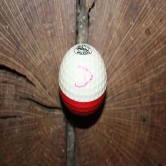 VINTAGE RED AND WHITE PING GOLF BALL WITH PEBBLE BEACH LOGO