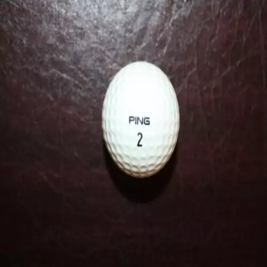 VINTAGE AQUA AND WHITE PING EYE GOLF BALL 