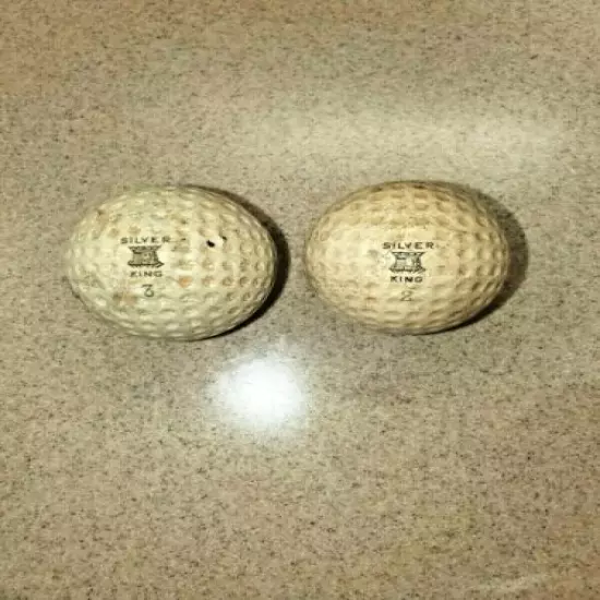 TWO VINTAGE SILVER KING GOLF BALLS WITH GEER PATENT & CALDWELL COVERS