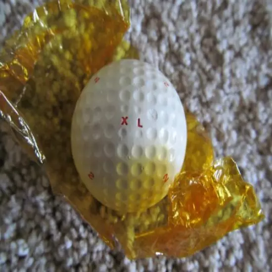 VINTAGE PARTIALLY WRAPPED XL DIMPLE GOLF BALL WITH MULTI MARKING