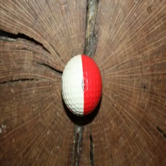 VINTAGE RED AND WHITE PING GOLF BALL WITH PEBBLE BEACH LOGO