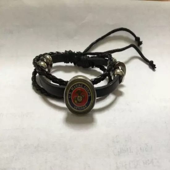 U S Marine veteran insignia button in leather bracelet