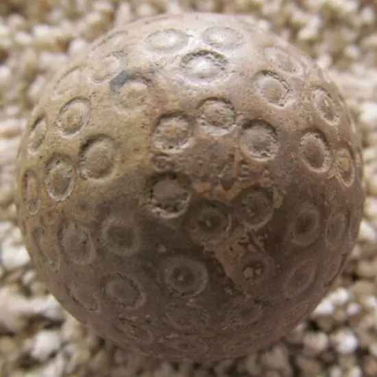 RARE CRIMEA GOLF BALL WITH UNUSUAL COVER PATTERN-A COUPLE OF STRIKE MARKS