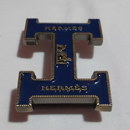 HERMES. Belt buckle with "HERMES" inscription. Gold-blue tone. 