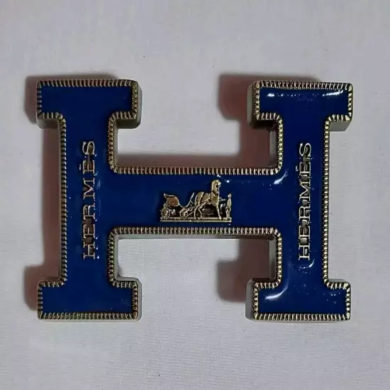 HERMES. Belt buckle with "HERMES" inscription. Gold-blue tone. 