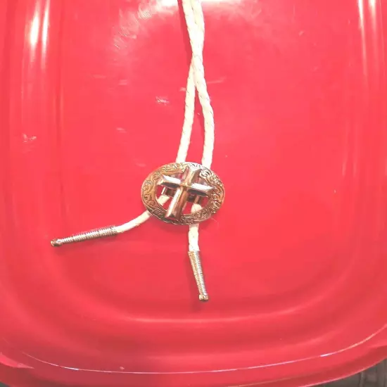 SILVER CHRISTIAN CROSS BOLO TIE, WHITE BRAIDED CORD SILVER TIPS. PHOTO IS ITEM 