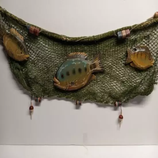 Green fish net with wooden fish and bobbers