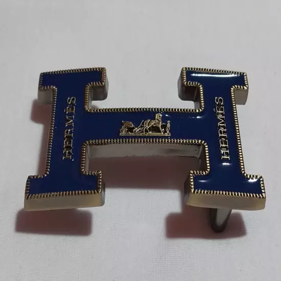 HERMES. Belt buckle with "HERMES" inscription. Gold-blue tone. 