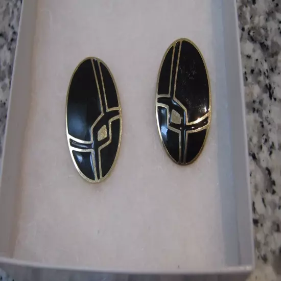 Very Pretty Black Pierced Earrings with a Gold Design Running Through Them