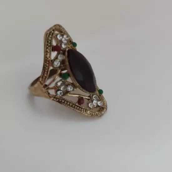 Distinctive women's ring in yellow color studded with colored stones, size 9