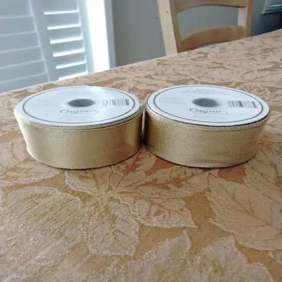  2 ROLLS OF CASPARI GOLD METALLIC RIBBON & ONE SMALL ROLL.