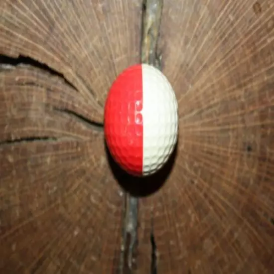 VINTAGE RED AND WHITE PING GOLF BALL WITH PEBBLE BEACH LOGO