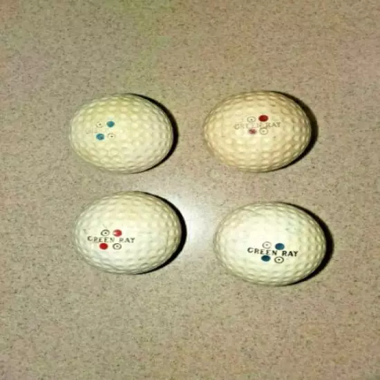 FIVE VINTAGE 1940'S ACUSHNET GREEN RAYS & TWO WRIGHT & DITSON BIRDIE BALLS