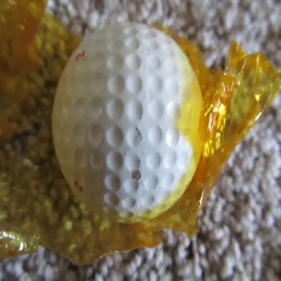 VINTAGE PARTIALLY WRAPPED XL DIMPLE GOLF BALL WITH MULTI MARKING